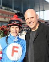 jockey Junior Alvarado and New York Yankees World Series Champion catcher Jim Leyritz, who made the Garland of Roses trophy presentation. 

 