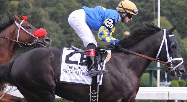 Shanghai Bobby (no. 2A), ridden by Rosie Napravnik and trained by Todd Pletcher, wins the grade 2 Hopeful Stakes for three year olds on September 3, 2012 at Saratoga Race Track in Saratoga Springs, New York. (Bob Mayberger/Eclipse Sportswire)