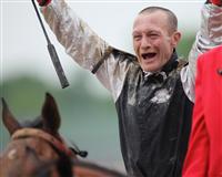 Calvin Borel celebrates his Kentucky Derby win with Mine That Bird