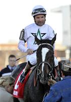 Kent Desormeaux and Hold Me Back enter the winner's circle for the 2009 Lane's End Stakes